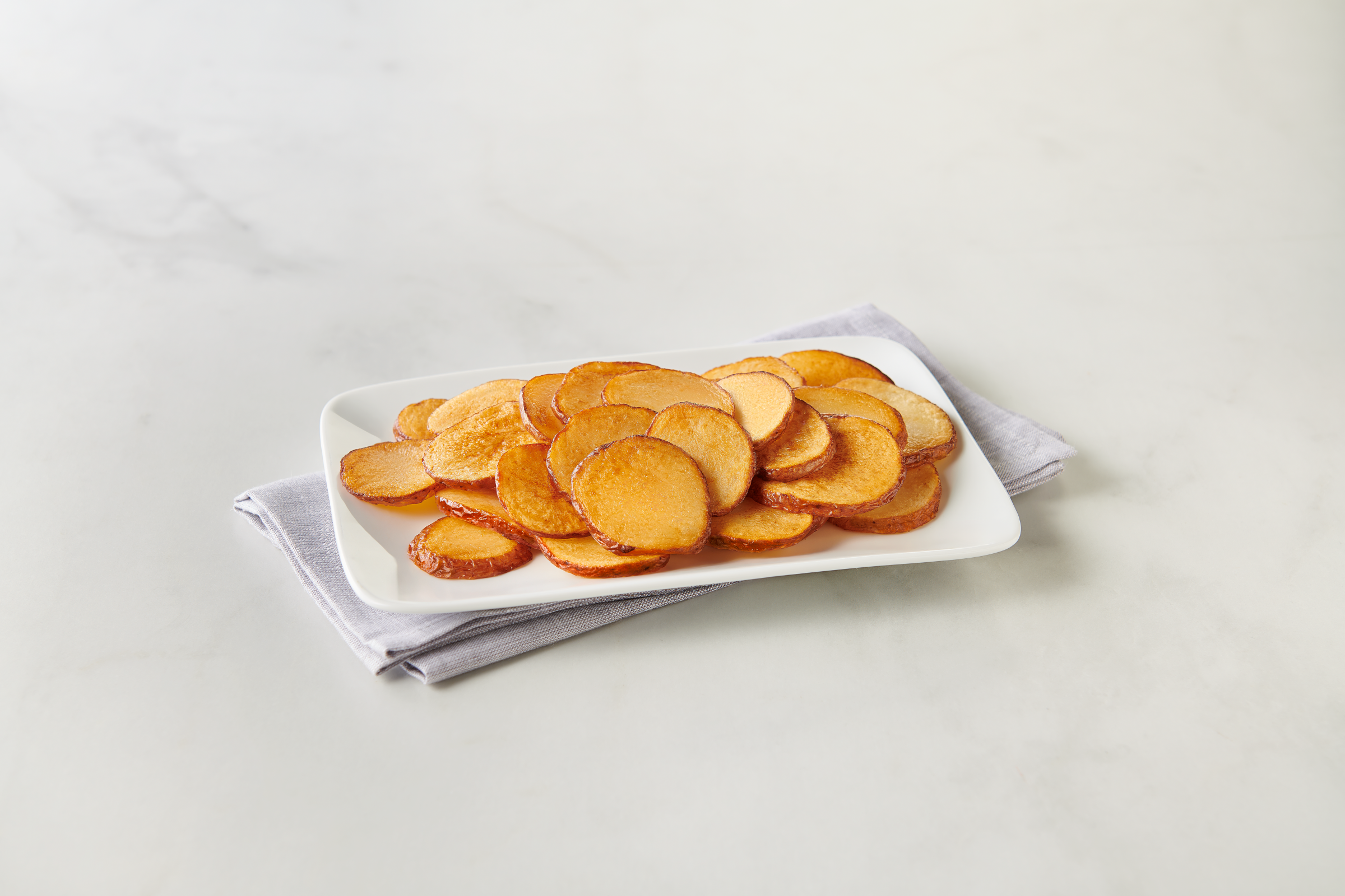 Simply Potatoes® Refrigerated Red Skin Sliced Potatoes made with skin on Red potatoes sliced 1/4" thick, 2/10 Lb Bags